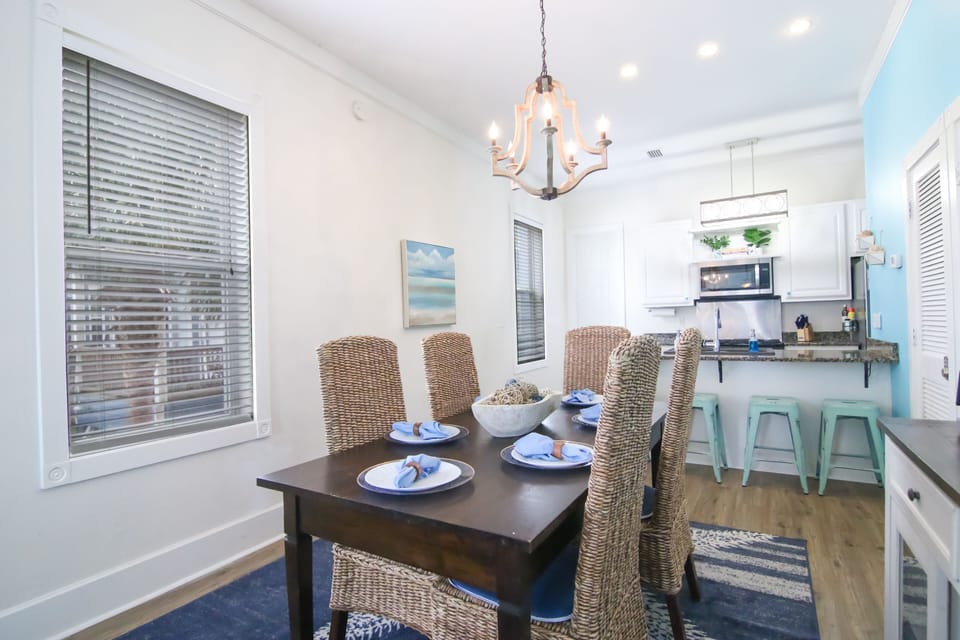 Open dining area with bar stools & an easy open floor plan for gathering