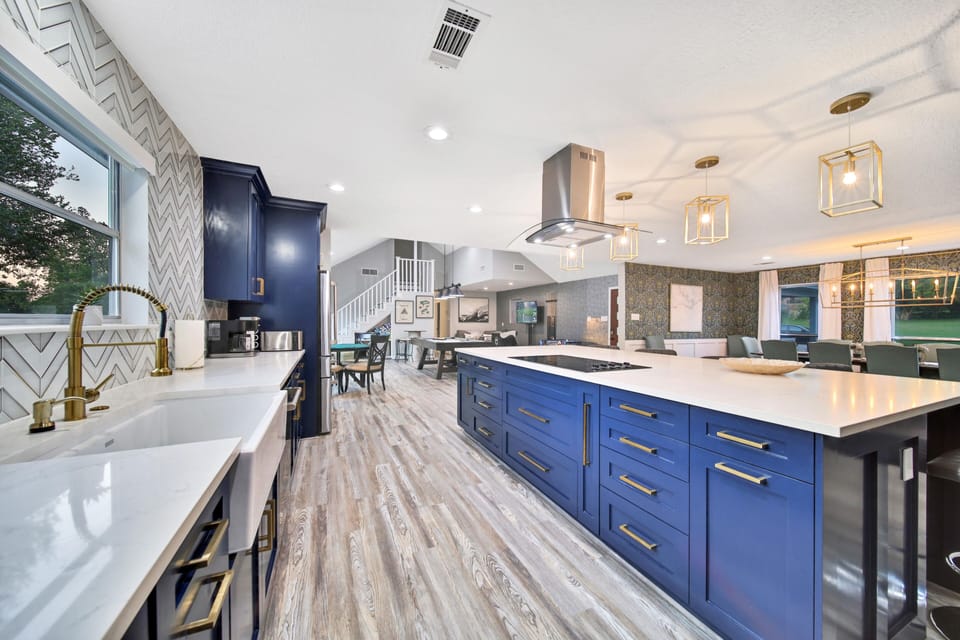 Close up of gorgeous and expansive kitchen w USB ports on either side of island.