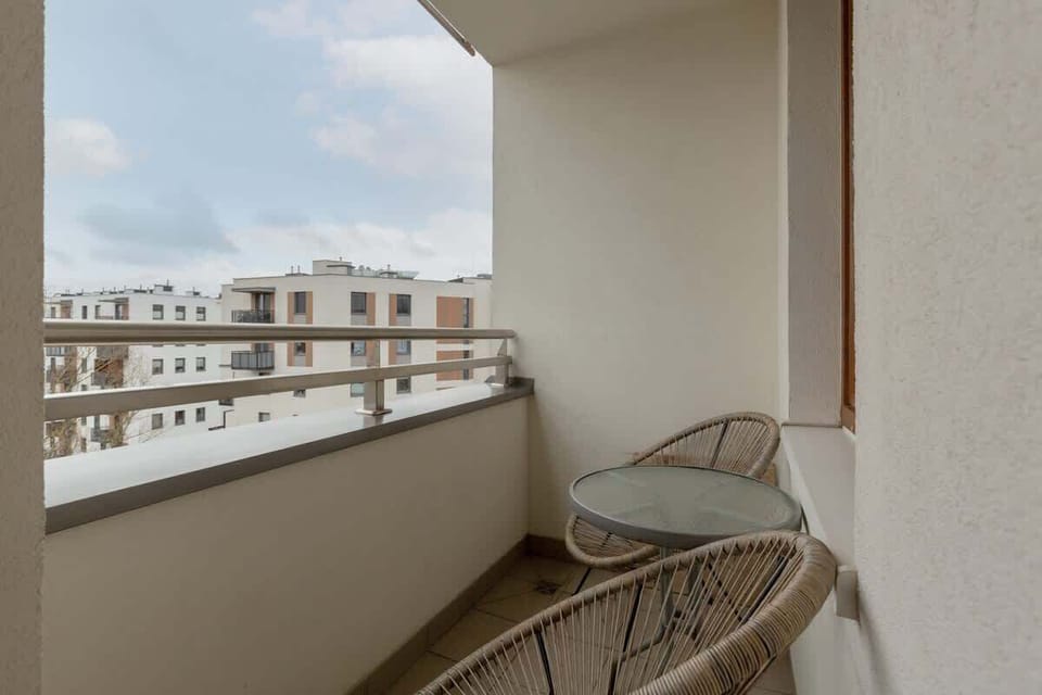 Relax on the balcony's comfortable chairs and enjoy the fresh air.