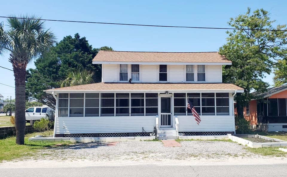 Welcome to the Beach House. Don't mind Ollie the owl, he's our mascot!