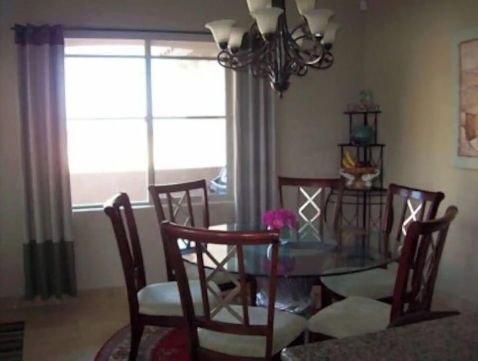 Dining area with view of the beach, sunrise, sunset