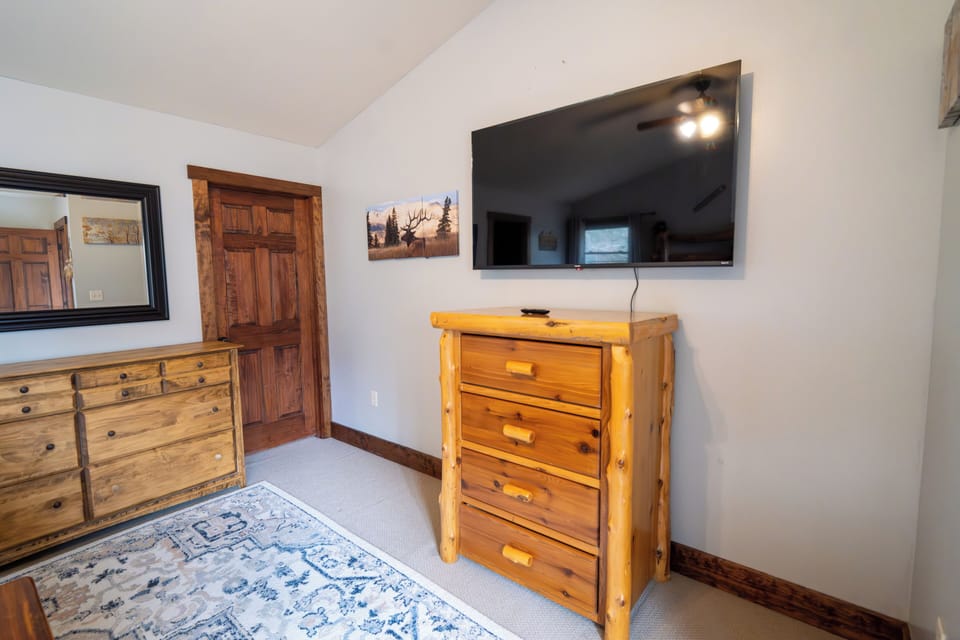 Master Bedroom with 2 dressers, large walk-in closet and TV for your enjoyment?