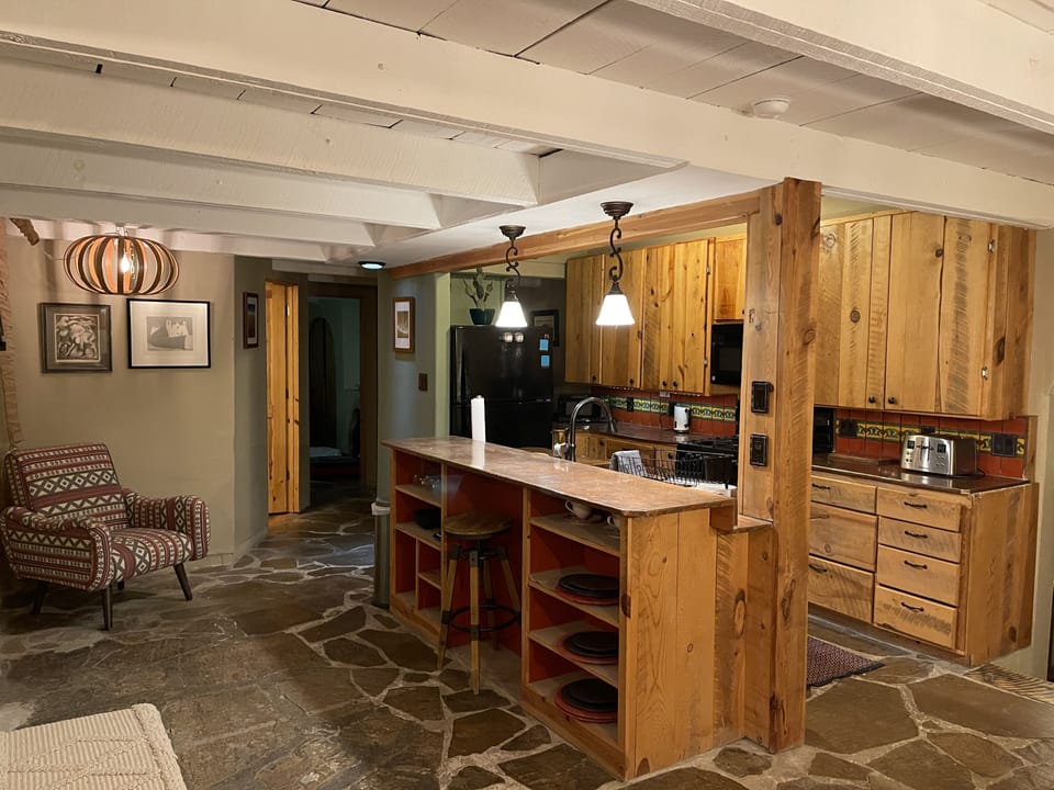 Passthrough with traditional Adobe Kitchen and Copper countertops