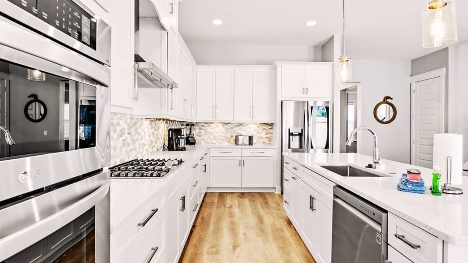 Our kitchen has all the essential cookware, full-sized stove/oven, microwave, and dishwasher.
