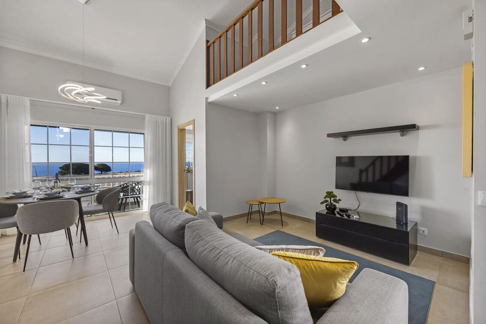 Open plan living area with sea views
