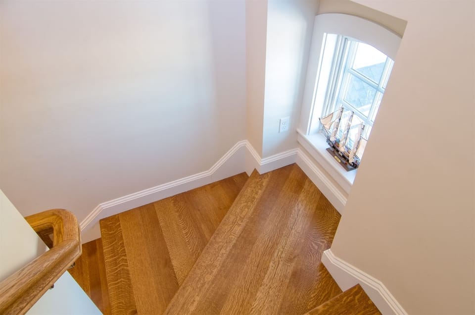 Stairs leading to the second and third floors.