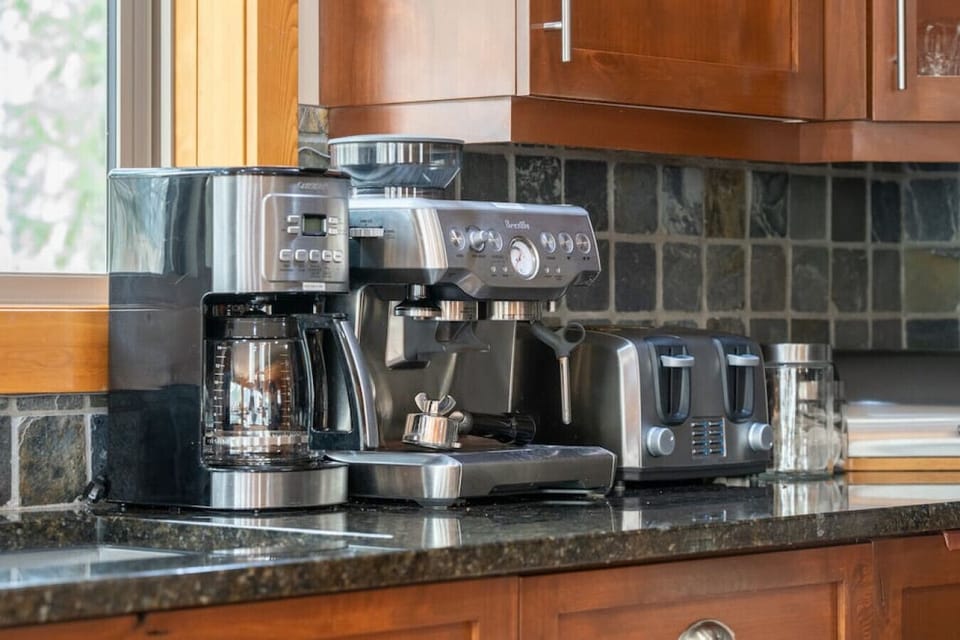 Luxurious kitchen space complete with multiple coffee makers (Espresso/Drip/Nespresso/Keurig machines & French press), waffle maker, griddle, blender, rice cooker, slow cooker & more!