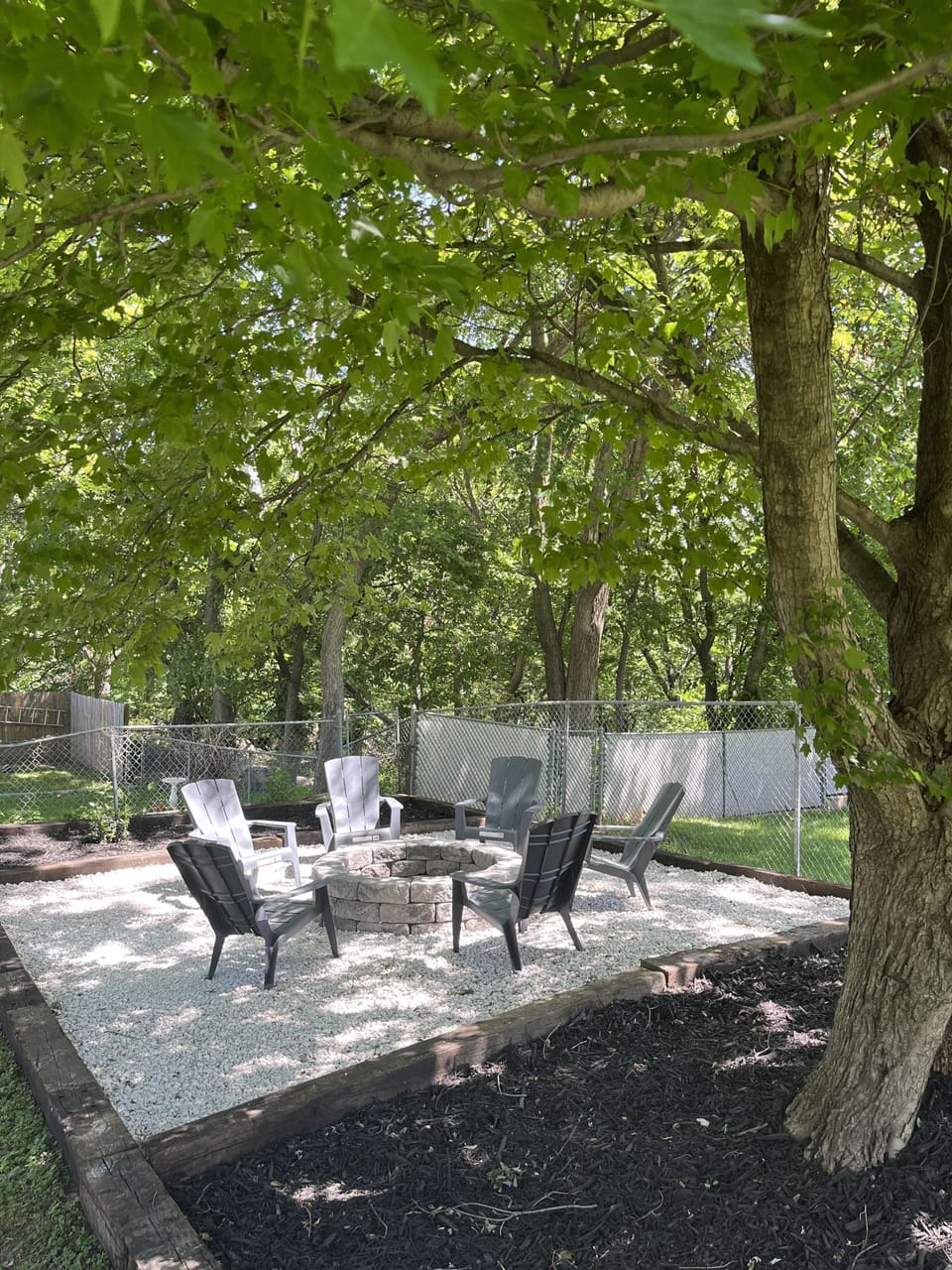 Large fire pit and backyard seating area