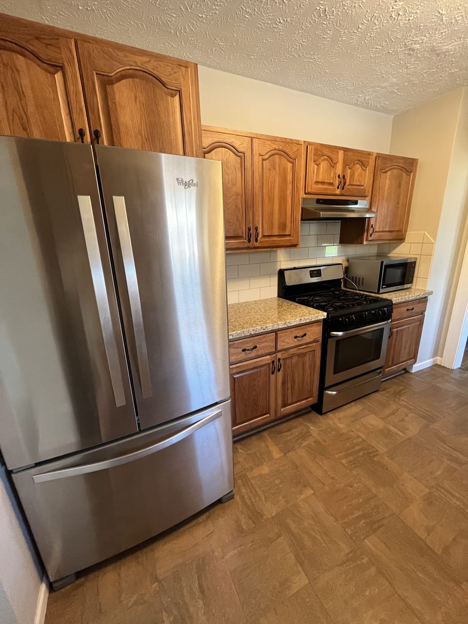 Large & well furnished kitchen with stainless appliances