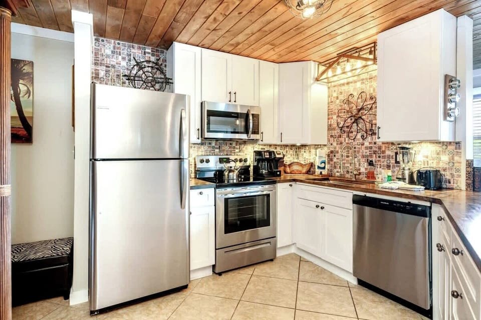 We've stocked this kitchen with full appliances, dishes, bake ware, pots & pans, silverware, utensils, crockpot, blender, and a traditional coffee maker & Keurig!