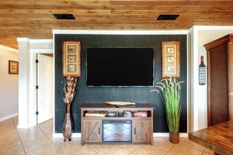 Kick back, relax, and watch your favorite shows on our large smart TV on the "gator skin" wall!