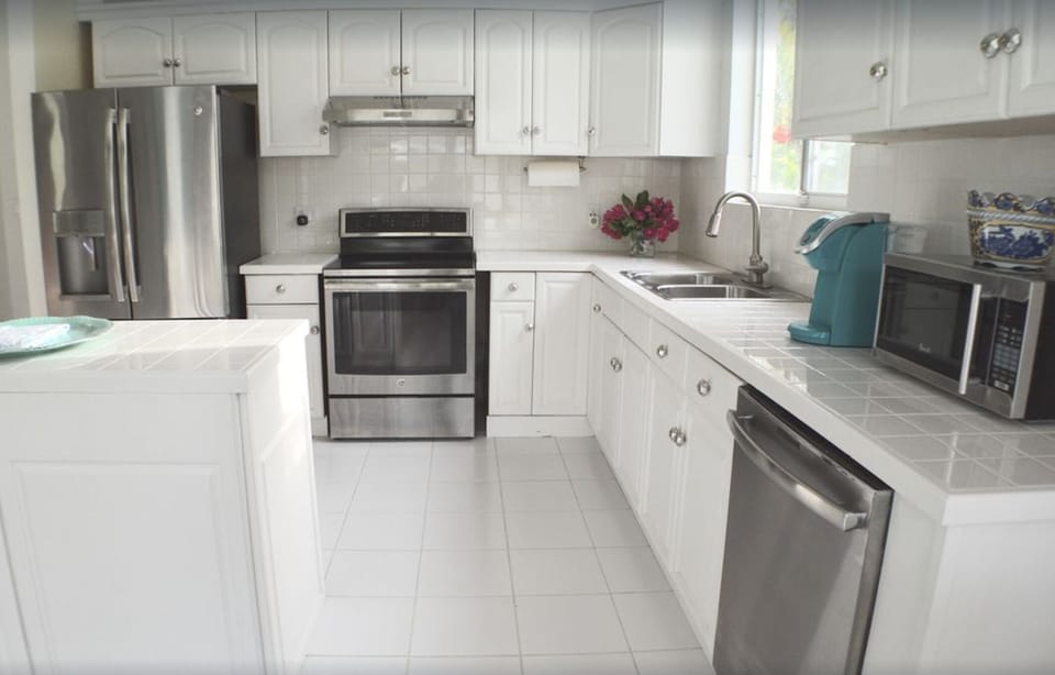 Bright, spacious kitchen with all stainless steel appliances and all utensils