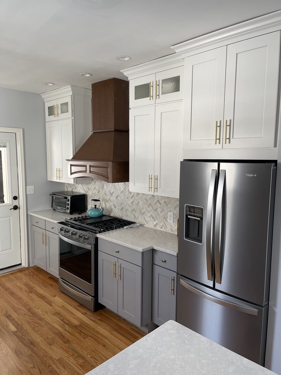 Renovated kitchen with modern appliances including a WiFi enabled stove