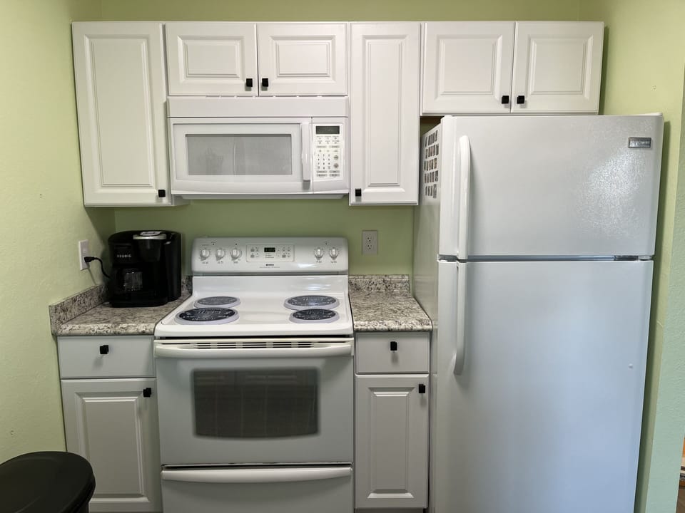 Coffee pot & K-cup combination. Coffee filters in drawer. 
