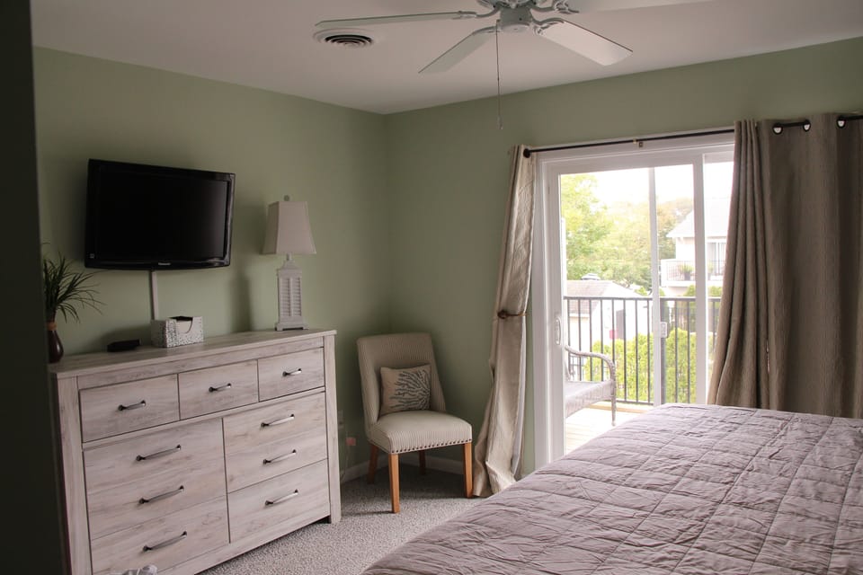 Primary bedroom with balcony