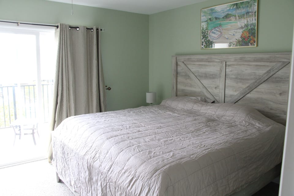 Primary bedroom with balcony