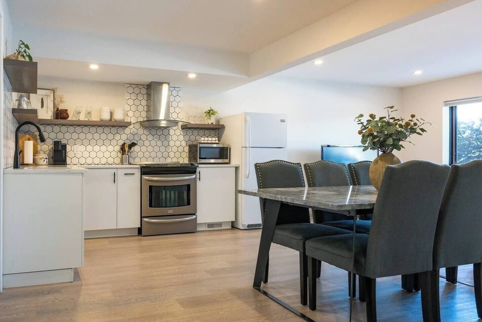 Spacious and bright open concept common living areas with full height windows