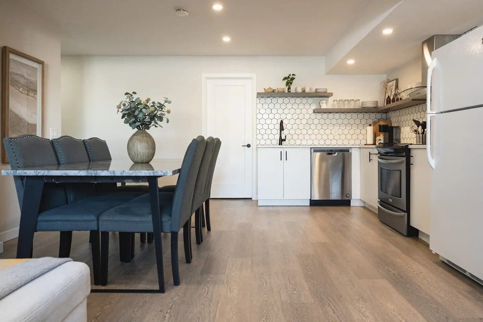 Spacious and bright open concept common living areas with full height windows