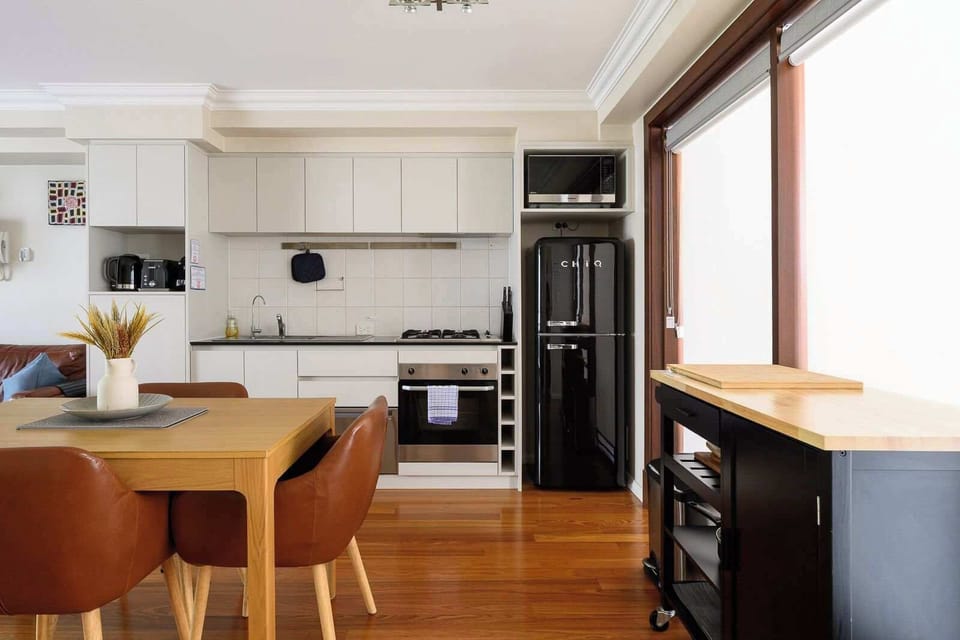 Fully equipped with oven, stove, fridge, and dining area. Your cooking and eating convenience starts here.