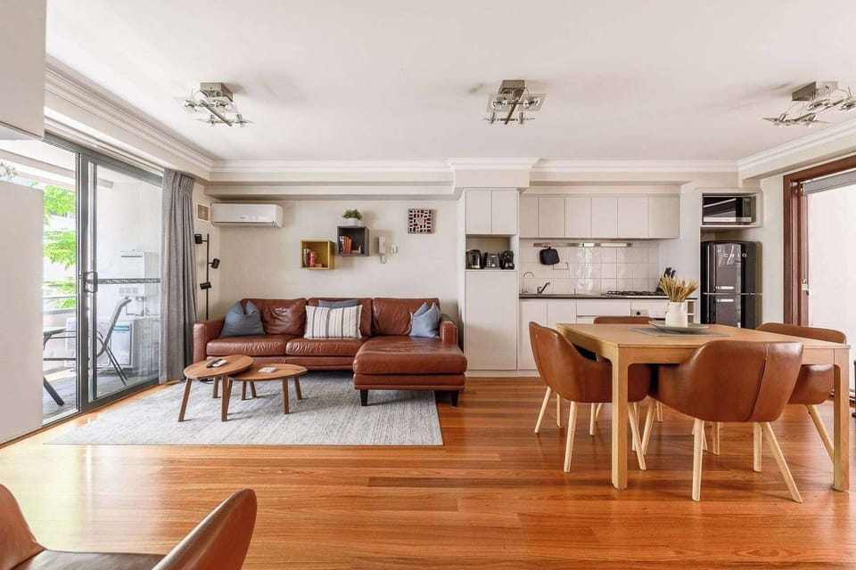 Enjoy a bright, spacious area with AC, a cozy living room, and a fully equipped kitchen (stove, oven, fridge). Seamless flow to the dining and balcony seating makes this space perfect for relaxing and gathering.
