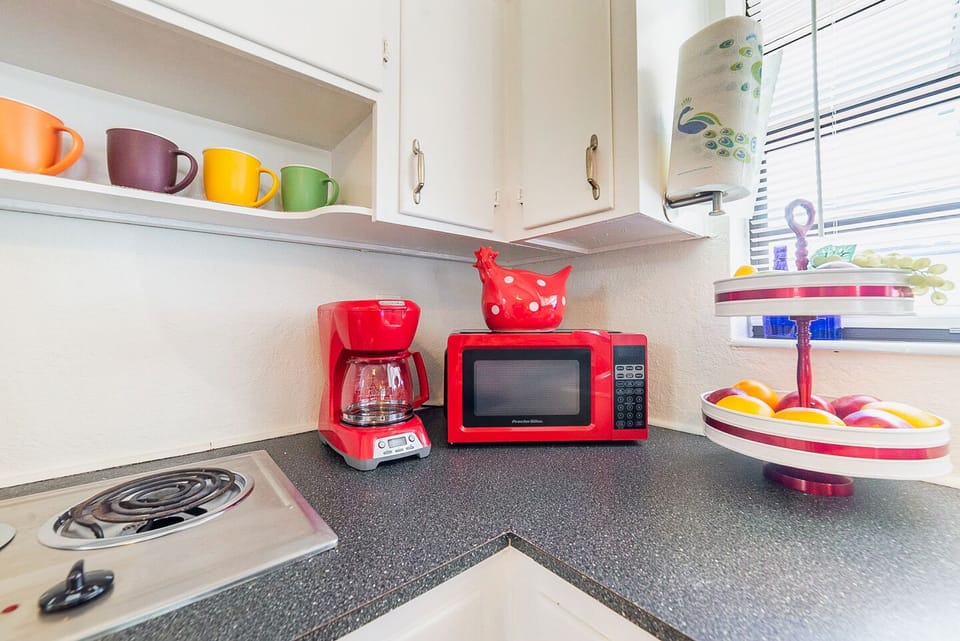 Stove has just two burners, but the kitchen is fully equipped for real cooking.