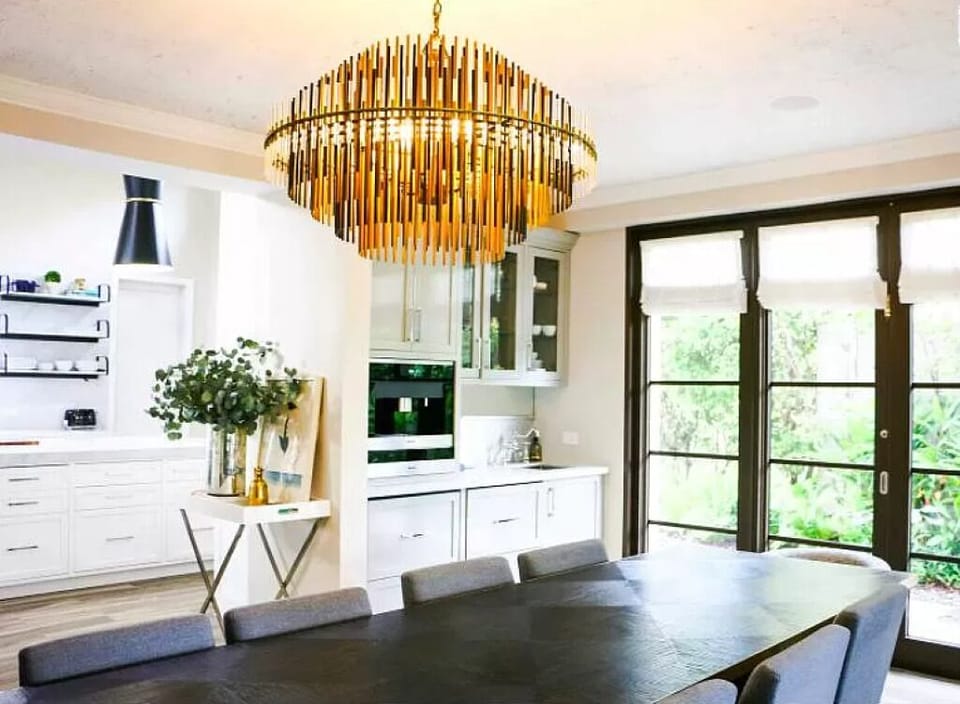 French doors lead to the Villa exterior. Elegant State of the art chandelier