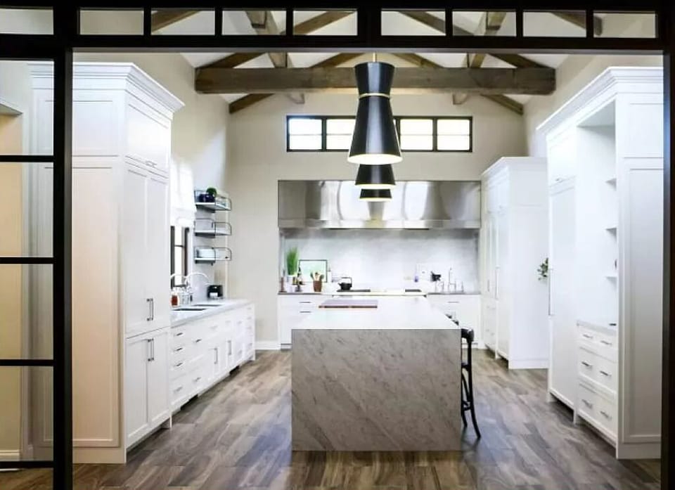 White-flush cabinetry complete with modern appliances. 