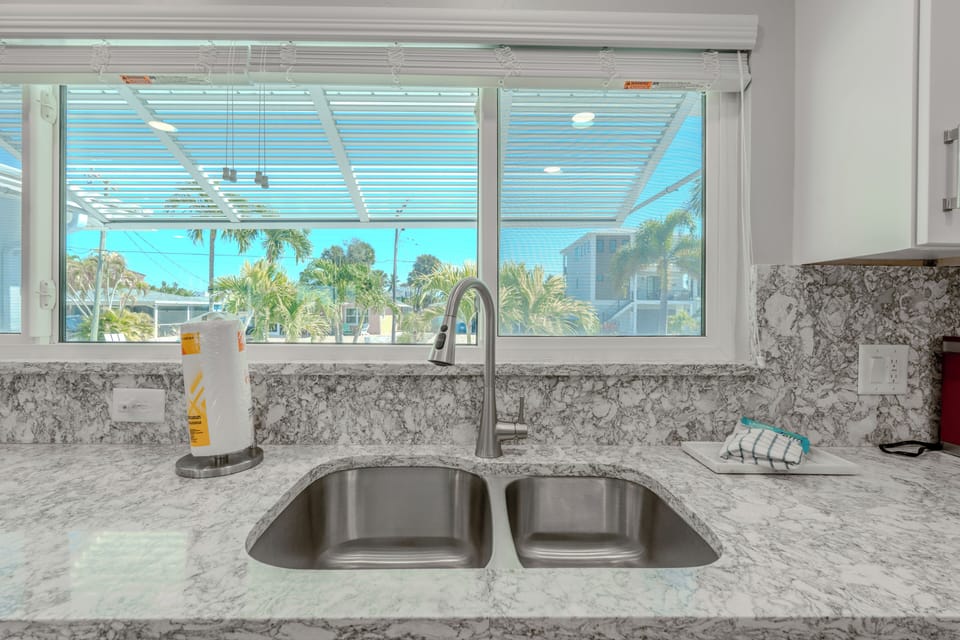 Kitchen with palm tree views.