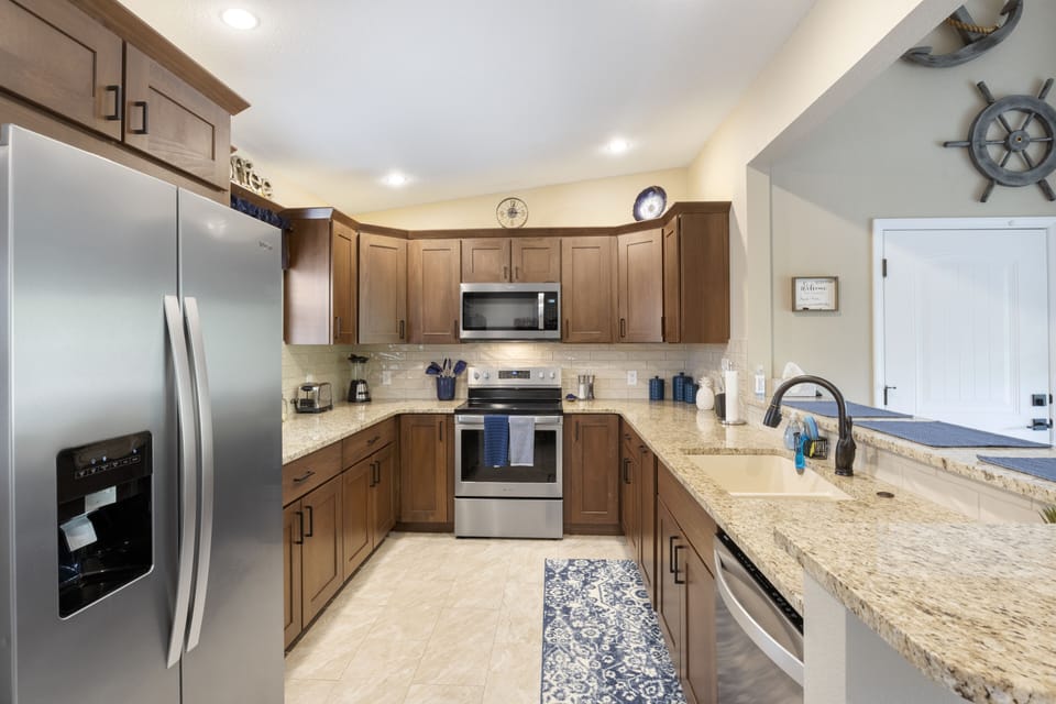 New stainless steel appliances and granite countertops