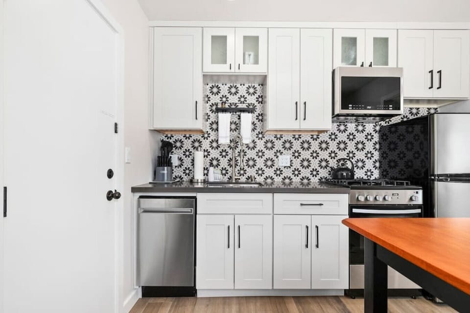 Kitchen complete with dishwasher, over & full sized fridge