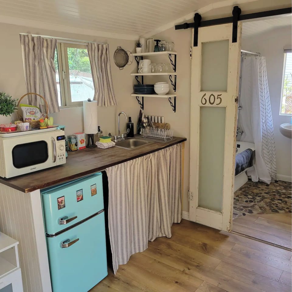 The quaint kitchenette with retro-style mini fridge/freezer.
