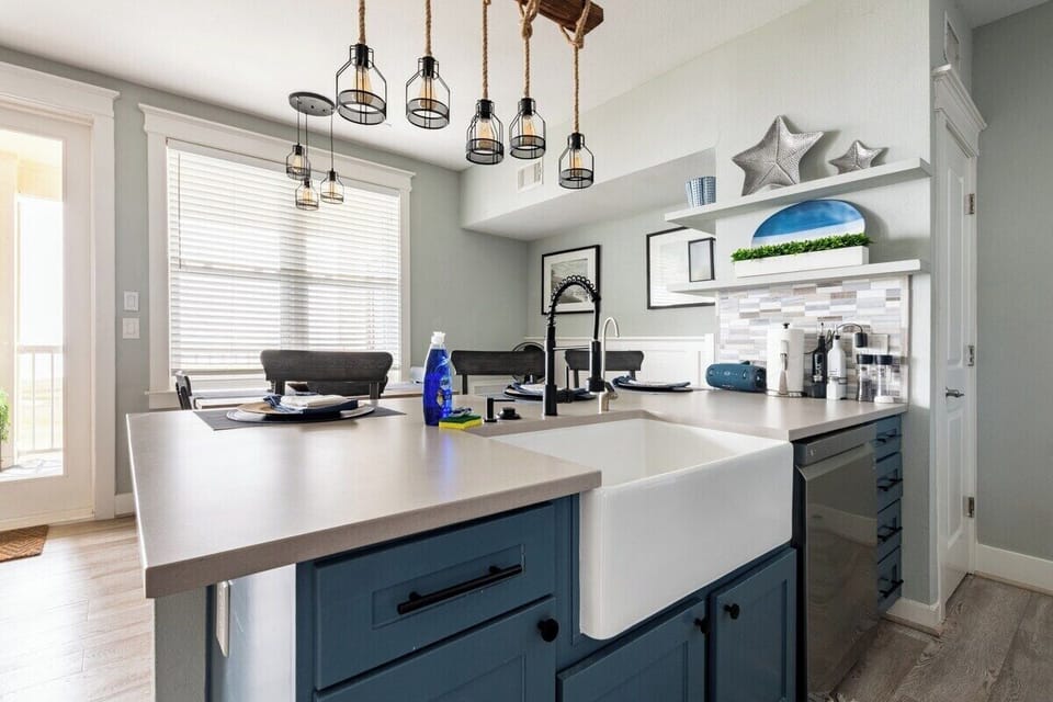 Farmhouse sink with seating for three at bar and water views. Filtered water.