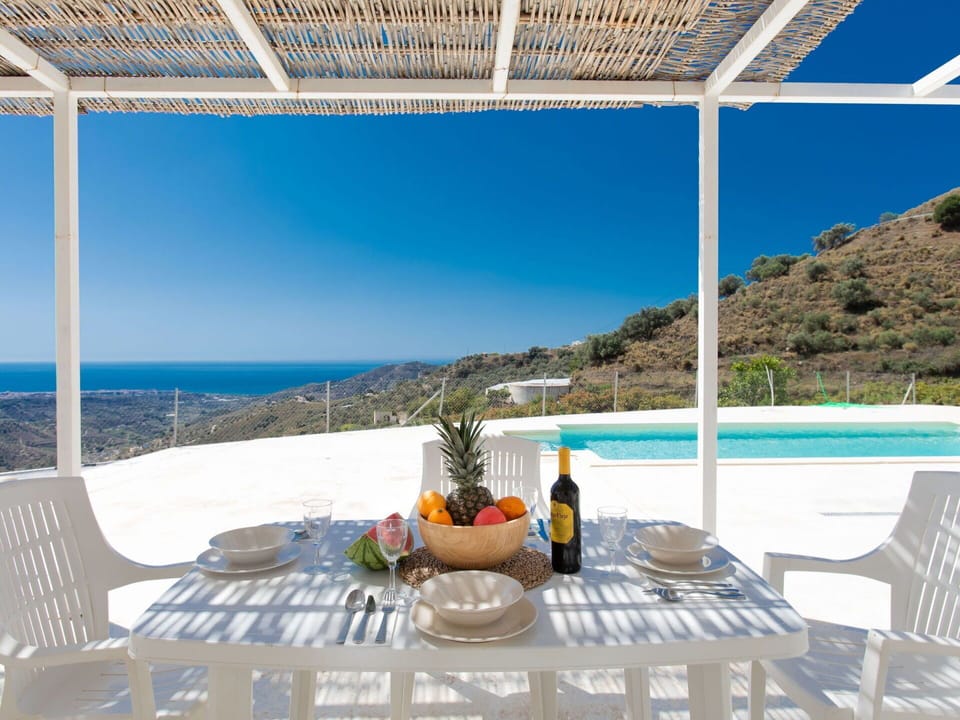 Sky, Table, Furniture, Building, Plant, Property, Water, Tableware, Chair, Seaside Resort