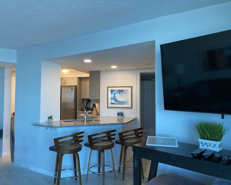 Dining and Breakfast bar area looking into the kitchen.