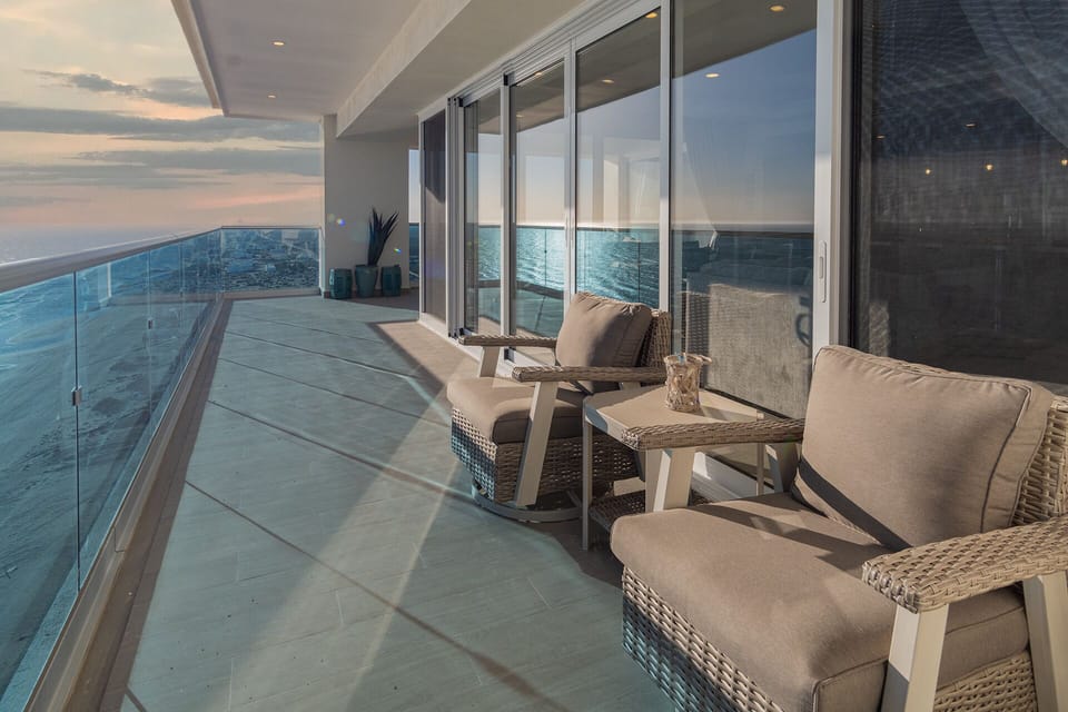 The wrap around patio offers these sliding chairs for a restful experience.