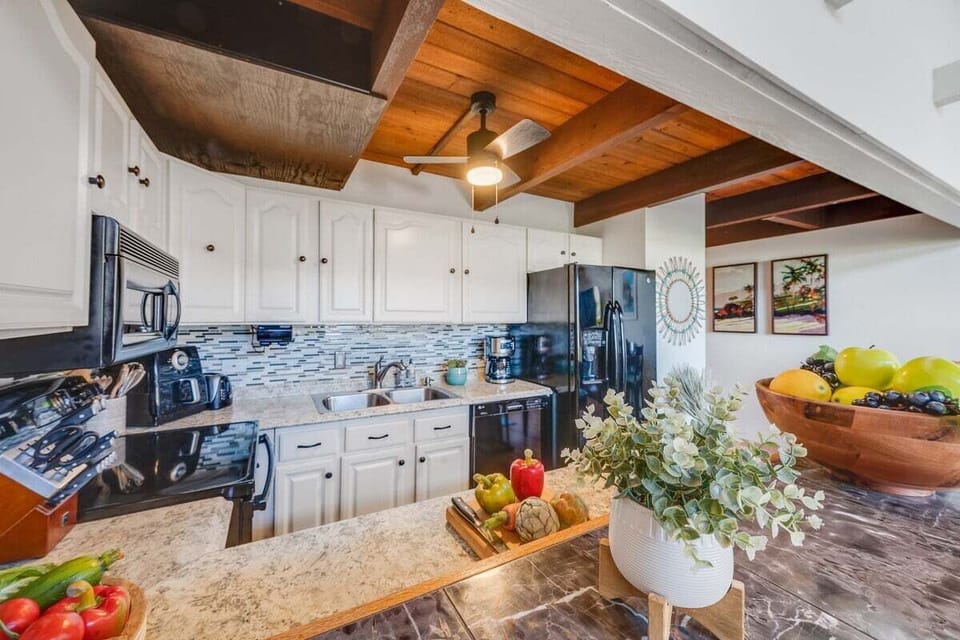 Fully equipped kitchen with modern appliances and ample counter space.