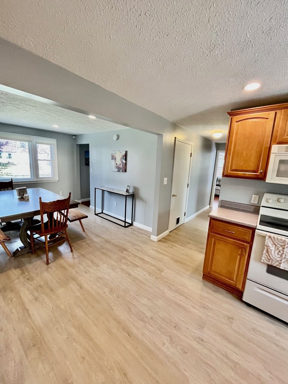 Kitchen and dining. Hallway leads to the living room.
