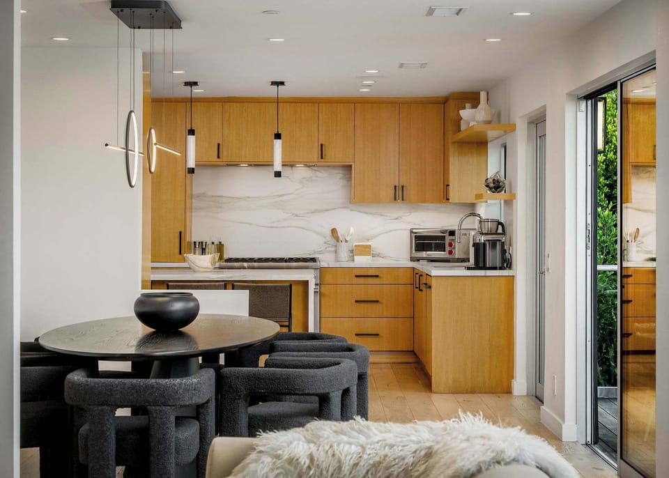 A fully outfitted chef’s kitchen with high-end appliances, 3 counter stools, Nespresso and Breville coffee makers, plus complete dinnerware, flatware, drinkware, and bakeware—designed for effortless cooking and entertaining.