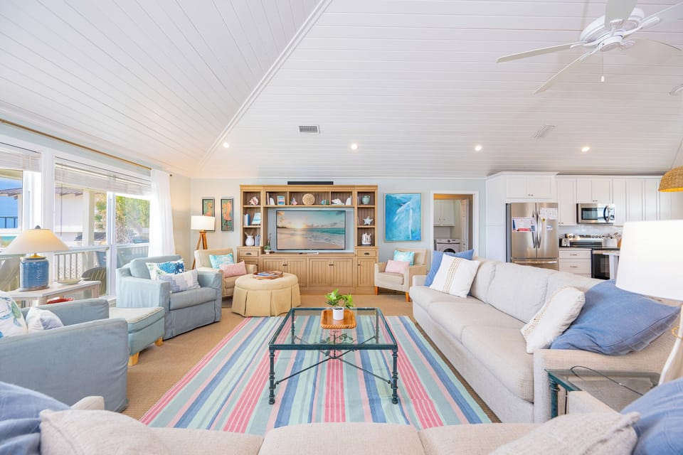 A cozy living room with plush seating invites you to unwind while your favorite show streams on the TV