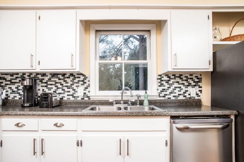 the kitchen window overlooks the back yard
