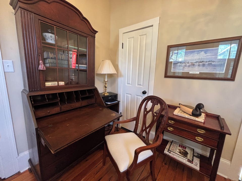 Secretary-style desk, chair and printer in office/study for your use