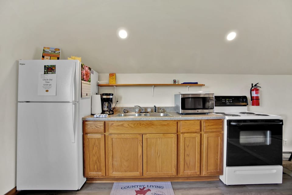 Efficiency kitchen, coffee pot with basket filter, electric range. (1)