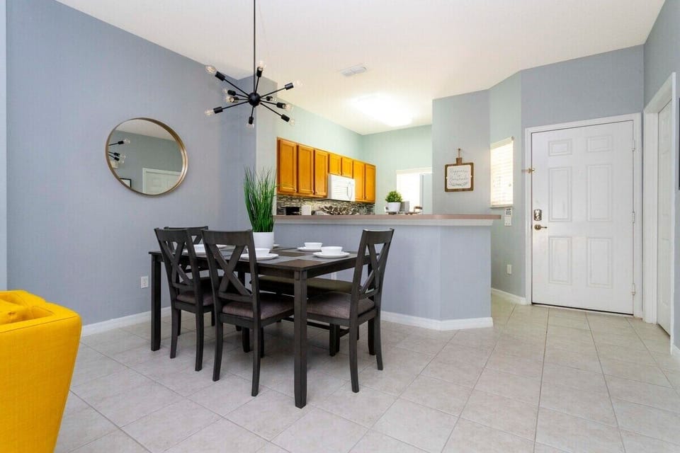 Open living space that seamlessly connects the beautiful kitchen and dining area, offering a perfect blend of comfort and style.