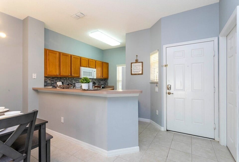 The cozy kitchen is equipped with the essentials for preparing meals for your family  and enjoying a casual dining experience