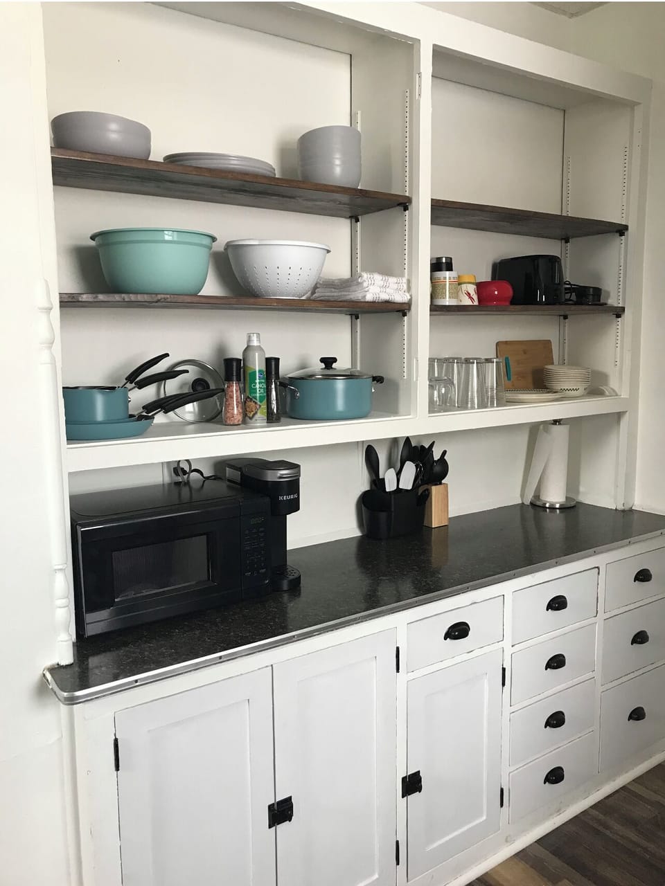 Kitchen fully stocked with cooking essentials, keurig 