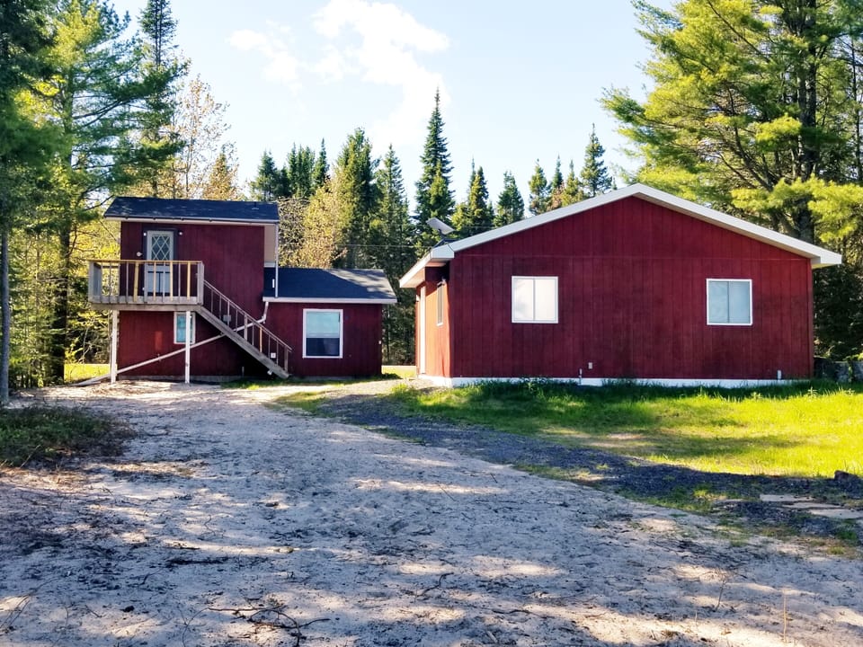 The cabin is on the left, the right is a garage used for storage.  