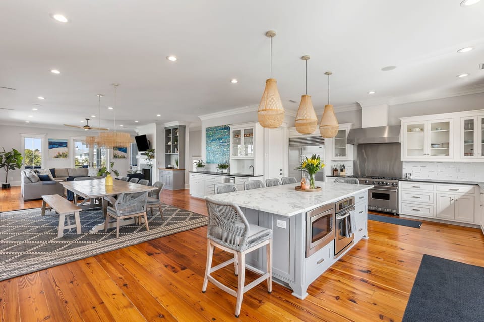 Open floor plan living, kitchen and dining