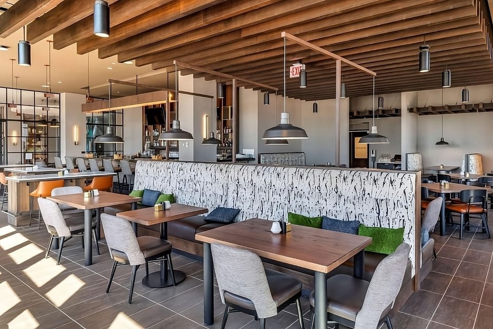 Linger over meals in a warm, modern dining space.