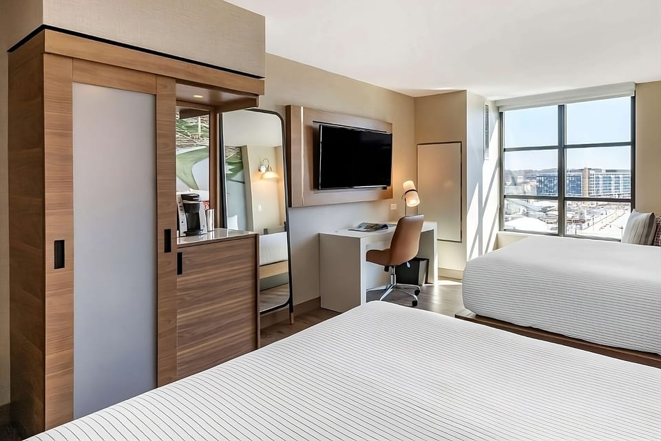 Recharge with a cozy work nook, big TV, and sunlit views.