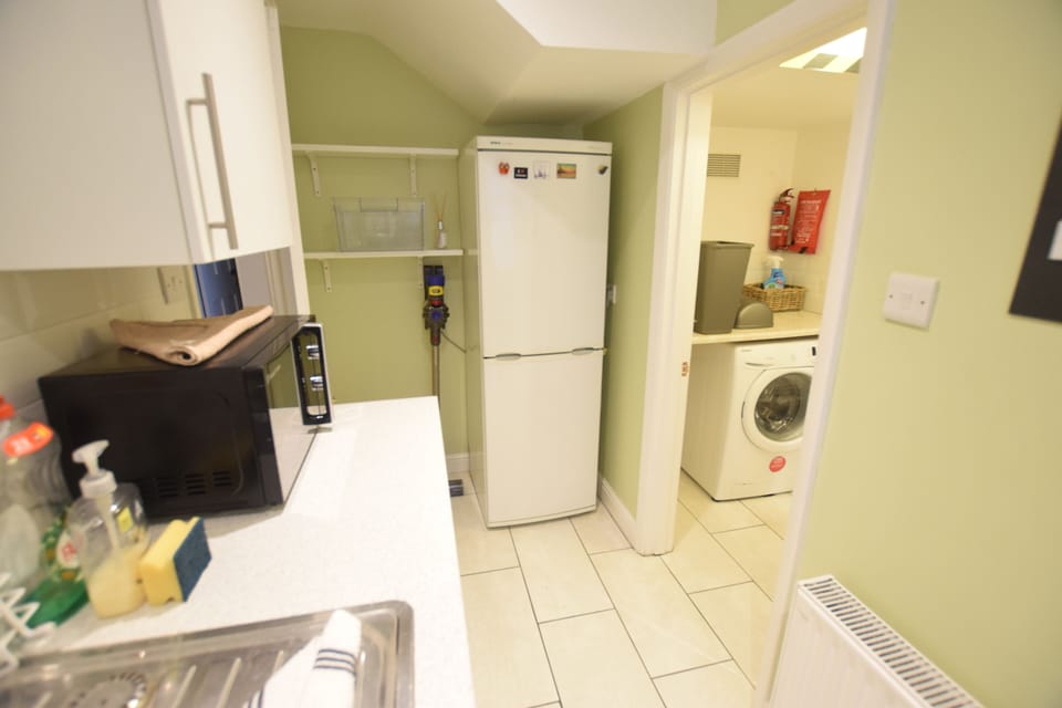 The fully-equipped kitchen in our holiday apartment in Ryde, Isle of Wight